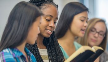 Teenage Girls Studying the Bible Together