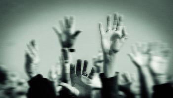 Hands Raised in a Crowd