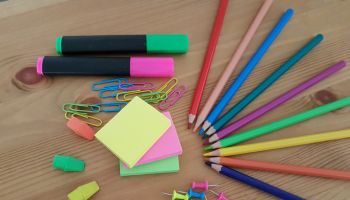 High Angle View Of Multi Colored School Supplies On Table