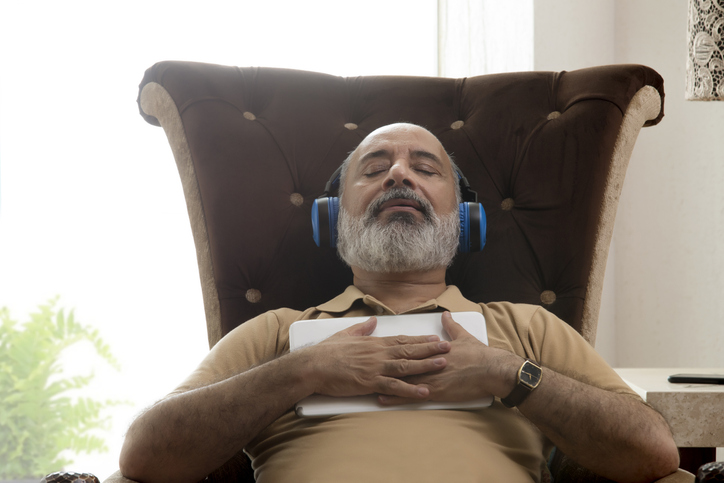 Senior man relaxing with eyes closed