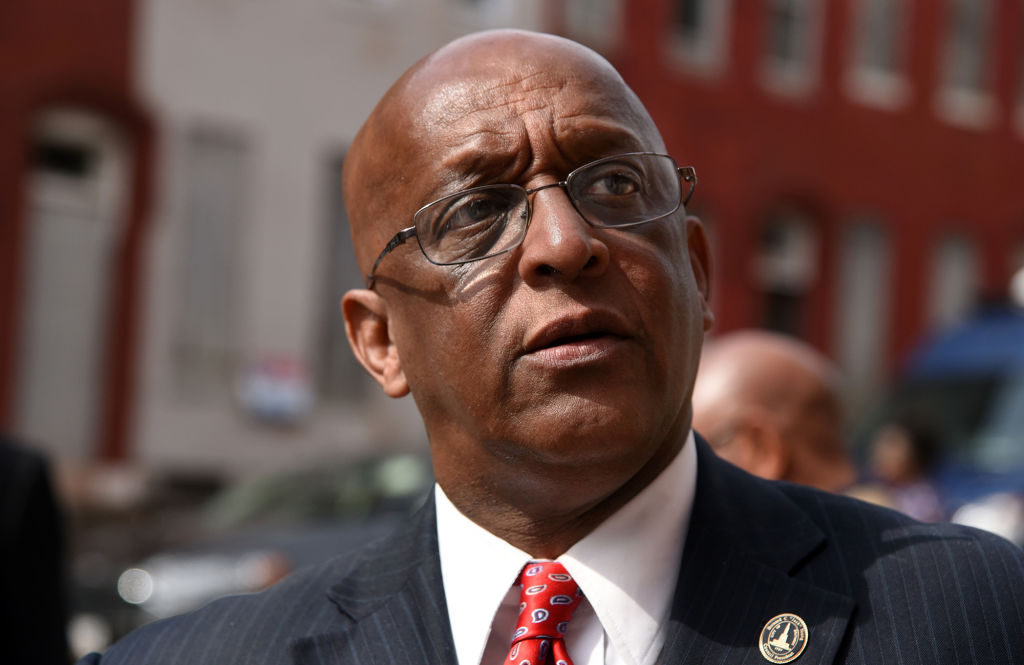 Baltimore's 51st mayor spends his first full day on the job 527 miles away, his phone ringing nonstop