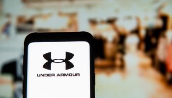 In this photo illustration an Under Armour logo seen...