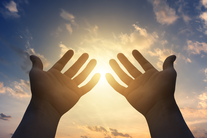 Human hands open palm up to worship god Jesus Christ
