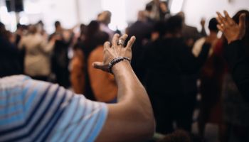 Hands Raised in Worship in Sunday Church Service