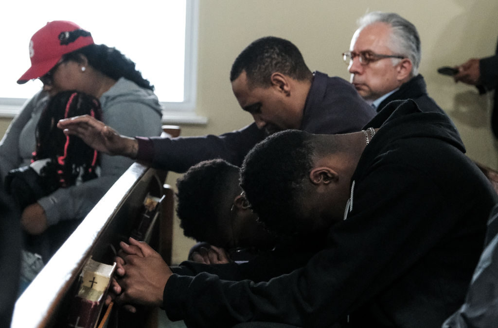 BALTIMORE, MD - MARCH 26: Members of the community gather at Mo